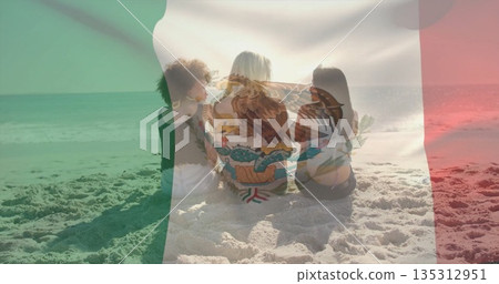 Sitting three women in swimwear on shore facing calm ocean, with eagle-emblem Mexican flag overlay Sitting three women in swimwear on shore facing calm ocean, with eagle-emblem Mexican flag overlay 135312951