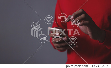 Young man hand using smartphone with to Interconnect, Interconnected Concept; People connect via wireless internet in a world of digital technology and communications that connect 135313404