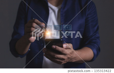 Man using smartphone, Tax online internet network, Tax Time, Offers online tax refund forms for paying taxes, Submitting tax forms online, Signing taxes online, Managing taxes via the internet network 135313422