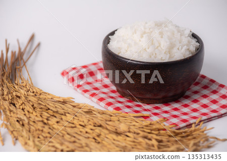 White rice in wooden bowl on white background, Rice from asia, Rice food of asian style White rice in wooden bowl on white background, Rice from asia, Rice food of asian style 135313435