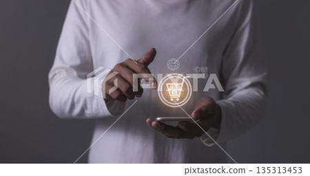 Young Man Using Smartphone For Online shopping, Mobile payment, Online payment, Digital, Bank account phone, Mobile banking payment concept Young Man Using Smartphone For Online shopping, Mobile payment, Online payment, Digital, Bank account phone, Mobile banking payment concept 135313453