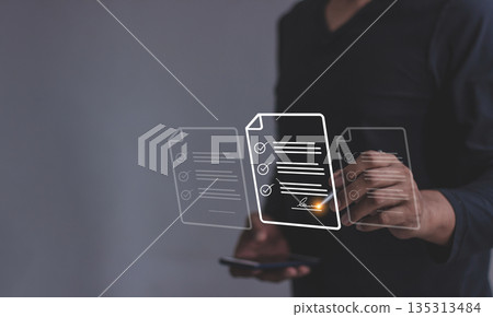 Young man with smartphone mobile hand using a pen touching to sign a Online Business Contract, Electronic signature, Contract signing, Digital documents, Future smart contract 135313484