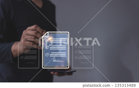 Young man with smartphone mobile hand using a pen touching to sign a Online Business Contract, Electronic signature, Contract signing, Digital documents, Future smart contract Young man with smartphone mobile hand using a pen touching to sign a Online Business Contract, Electronic signature, Contract signing, Digital documents, Future smart contract 135313489