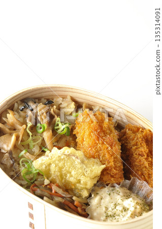 Mushroom rice and fried oyster bento photographed on a white background 135314091