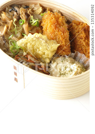Mushroom rice and fried oyster bento photographed on a white background 135314092