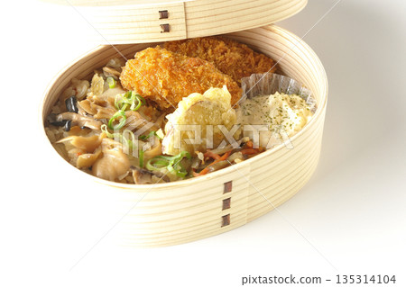 Mushroom rice and fried oyster bento photographed on a white background 135314104