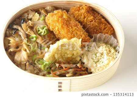 Mushroom rice and fried oyster bento photographed on a white background Mushroom rice and fried oyster bento photographed on a white background 135314113
