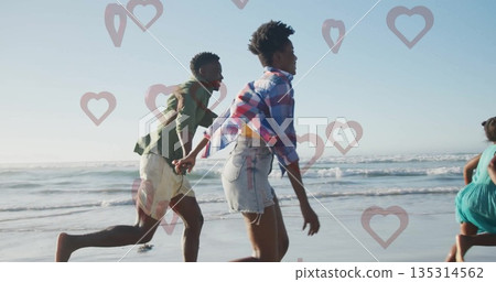 Running family holding hands along wet sandy shoreline at beach, with gentle ocean waves rolling Running family holding hands along wet sandy shoreline at beach, with gentle ocean waves rolling 135314562