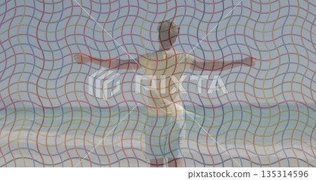 Balancing man in light blue swim shorts extending arms at sandy shoreline, with foamy surf waves Balancing man in light blue swim shorts extending arms at sandy shoreline, with foamy surf waves 135314596