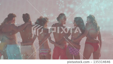 Standing six friends linking arms on sandy beach at sunset, with swimwear and ocean surf Standing six friends linking arms on sandy beach at sunset, with swimwear and ocean surf 135314646