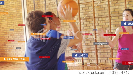 Dribbling boy in blue shirt playing basketball in school gym with notification icons, copy space Dribbling boy in blue shirt playing basketball in school gym with notification icons, copy space 135314742