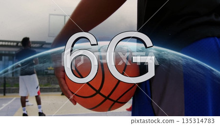 Player holding basketball in outdoor court with hoop, fence and 6G globe overlay, copy space Player holding basketball in outdoor court with hoop, fence and 6G globe overlay, copy space 135314783