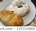 Donuts and bread on a white plate 135314866