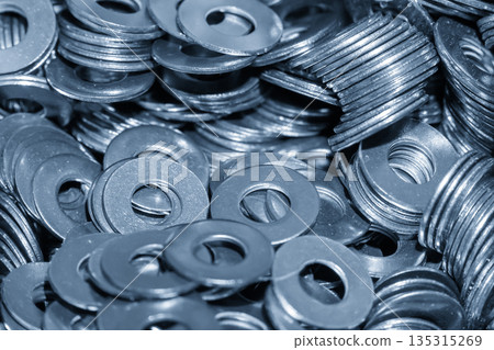 Steel Washer Mass Production in Industrial Manufacturing Concept Steel Washer Mass Production in Industrial Manufacturing Concept 135315269