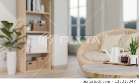 Iced coffee and tea pot on round wooden table and ratten wicker sofa chair in minimalist living room Iced coffee and tea pot on round wooden table and ratten wicker sofa chair in minimalist living room 135315347