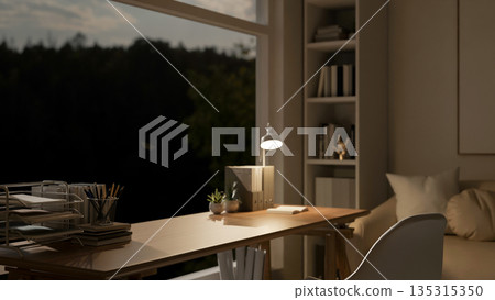 File folders and a lamp on wooden table and chair aside glass wall in a modern living room or office 135315350