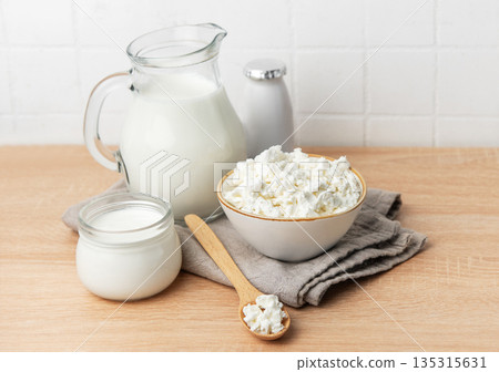 Fresh cottage cheese, milk, and yogurt creating a healthy breakfast Fresh cottage cheese, milk, and yogurt creating a healthy breakfast 135315631