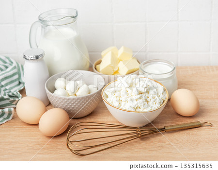 Dairy products and ingredients for baking on wooden table Dairy products and ingredients for baking on wooden table 135315635
