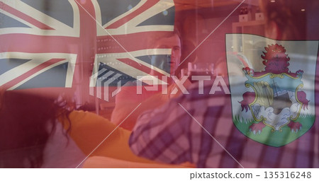 Posing for selfie friends wearing casual clothes on living room couch with phone and coffee table Posing for selfie friends wearing casual clothes on living room couch with phone and coffee table 135316248