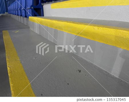 benches, stairs and an empty stadium for a sporting event 135317045