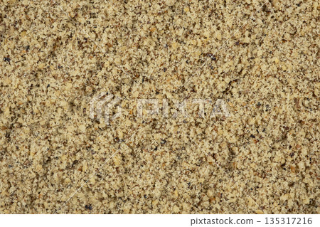 Macro crushed walnut kernels top view Macro crushed walnut kernels top view 135317216