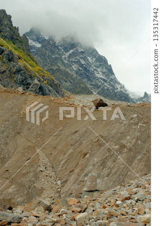 Chalaadi Glacier, ice, moraine and snow in the Caucasus Mountains in autumn, Mestia, Svaneti, Georgia. 135317442