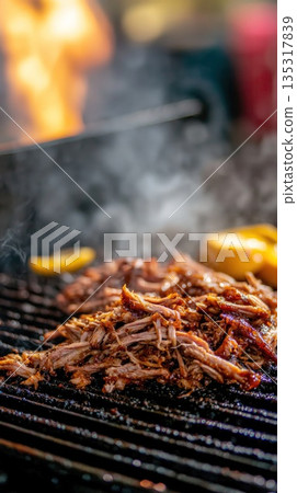 Savory Shredded Meat Cooking on a Hot Barbecue Grill with Flames and Smoke Rising in Outdoor Setting 135317839