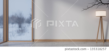 High floor lamp aside dried tree branch in a room with marble floor and snowing outside glass door. 135318257