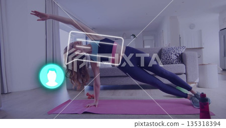 Holding side plank pose woman in sportswear on pink mat in living room, with digital overlay Holding side plank pose woman in sportswear on pink mat in living room, with digital overlay 135318394