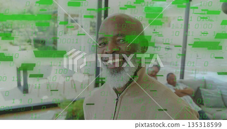 Smiling senior man wearing beige sweater in living room with sectional sofa and binary overlay 135318599