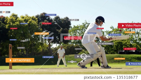 Swinging batsman in white gear hitting ball on cricket pitch, with digital overlays, copy space 135318677