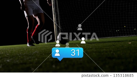 Poising soccer player legs next to ball on floodlit pitch, with net, overlay icons, bubble 31 Poising soccer player legs next to ball on floodlit pitch, with net, overlay icons, bubble 31 135318685