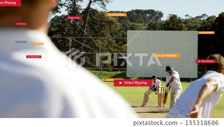 Bowling bowler delivering ball past batsman and keeper at cricket pitch with stumps plus overlays 135318686