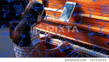 Chinese girl playing piano at home, wearing headphones, striped shirt with tablet and blue doodles Chinese girl playing piano at home, wearing headphones, striped shirt with tablet and blue doodles 135318725