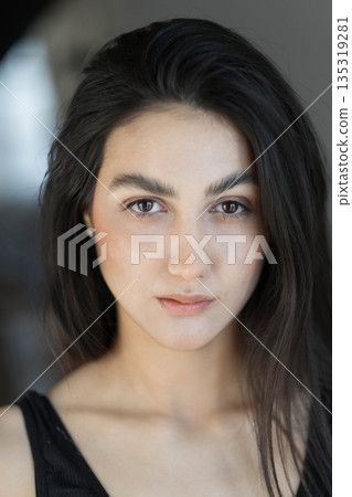 A woman with black hair wakes up in the morning in a white blanket and catches the rays of the sun. The portrait is creative, with brown eyes. High quality photo A woman with black hair wakes up in the morning in a white blanket and catches the rays of the sun. The portrait is creative, with brown eyes. High quality photo 135319281