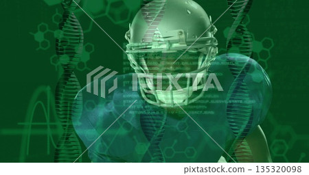 Showing football player wearing helmet, shoulder pads in virtual lab, with DNA helix code overlays 135320098
