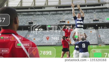 Lifting navy-and-white player reaching upward in rugby lineout at stadium, AR icons, copy space 135320168