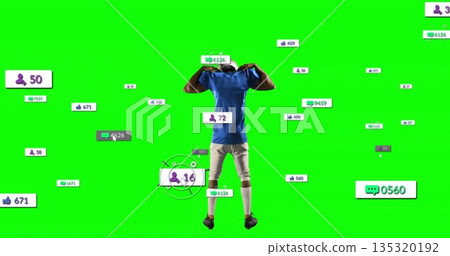 Flexing soccer player pulling jersey collar at green screen backdrop, with social media icons 135320192