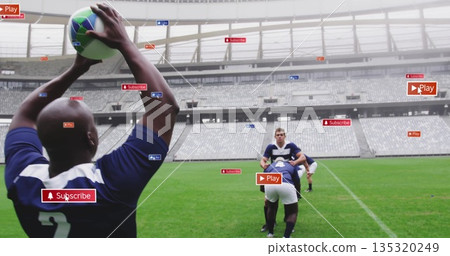 Raising player throwing multicolor rugby ball on pitch in stadium with digital overlays, copy space 135320249