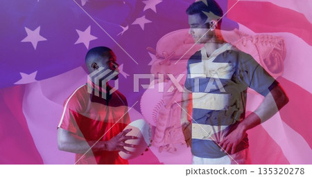 Displaying rival athletes facing each other in studio, with football, baseball glove and flag motif 135320278