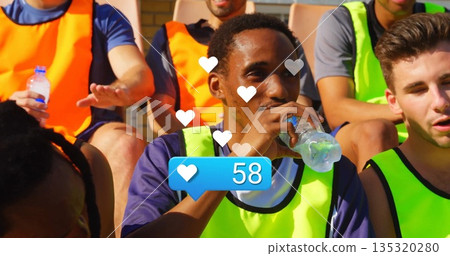 Athlete in neon green bib drinking from water bottle on bleachers, heart icons showing 58 likes 135320280
