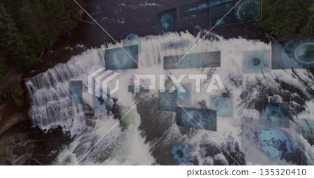 Displaying aerial waterfall cascading into frothy river by evergreens, with holographic data panels Displaying aerial waterfall cascading into frothy river by evergreens, with holographic data panels 135320410