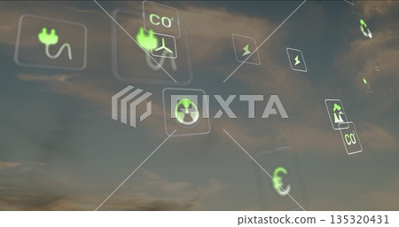 Displaying green energy icons floating in dusk sky, showing plug, CO2, lightning, nuclear, chart 135320431