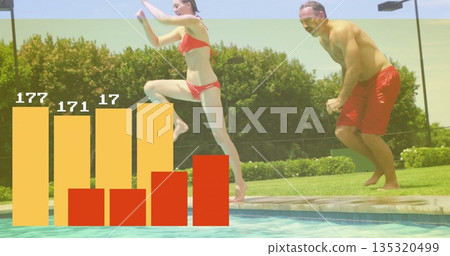 Leaping mid-adult woman in red bikini diving into pool at backyard facility with bar chart overlay 135320499