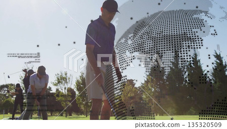 Putting man in navy polo, black cap making putt on green with globe overlay, copy space Putting man in navy polo, black cap making putt on green with globe overlay, copy space 135320509