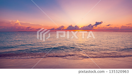 Panoramic sunset beach ocean waves sand close up colorful sky summer scenery Panoramic sunset beach ocean waves sand close up colorful sky summer scenery 135320963