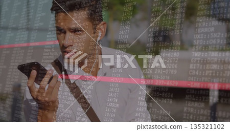 Hispanic man in white shirt with messenger bag speaking into smartphone on urban walkway, with code 135321102