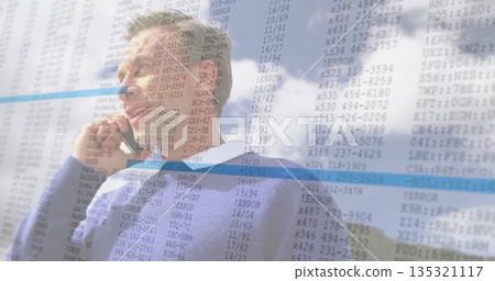 Businessman using smartphone, making phone call under cloudy sky, with error spreadsheet overlay 135321117