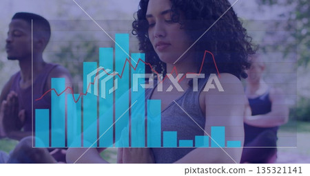 Woman in gray sleeveless top meditating in park, with translucent blue bar chart and red line 135321141