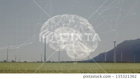 Floating digitally rendered brain overlay showing network lines above wind farm, with wind turbines 135321362